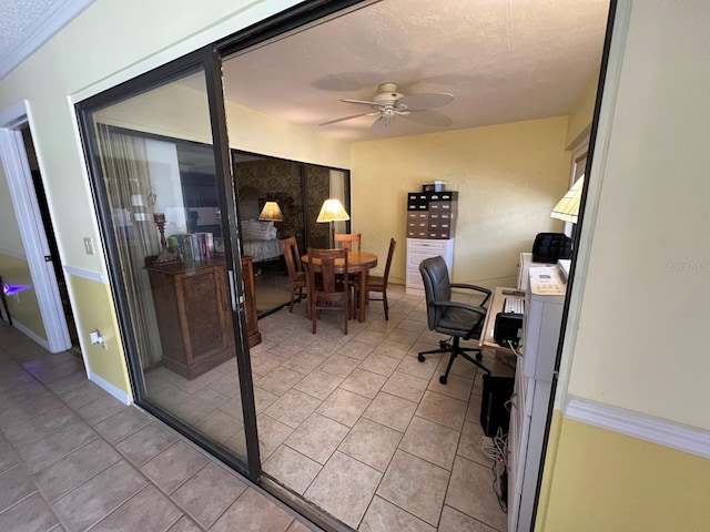 office space featuring ceiling fan and light tile patterned flooring