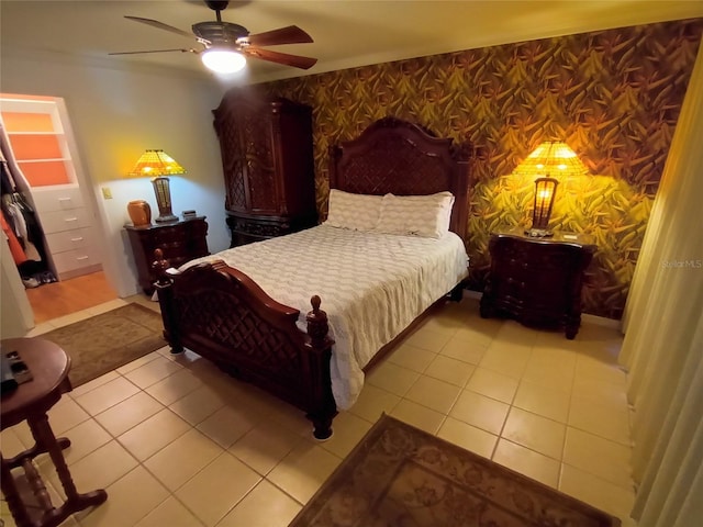 tiled bedroom with ceiling fan