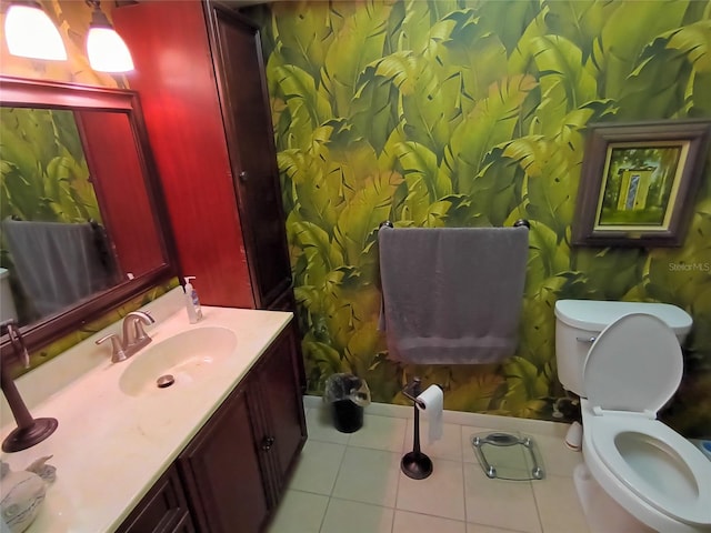 bathroom featuring tile patterned floors, vanity, and toilet