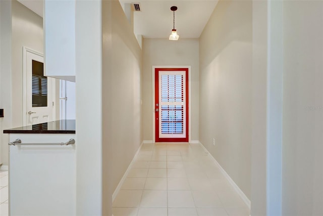 hall with light tile floors