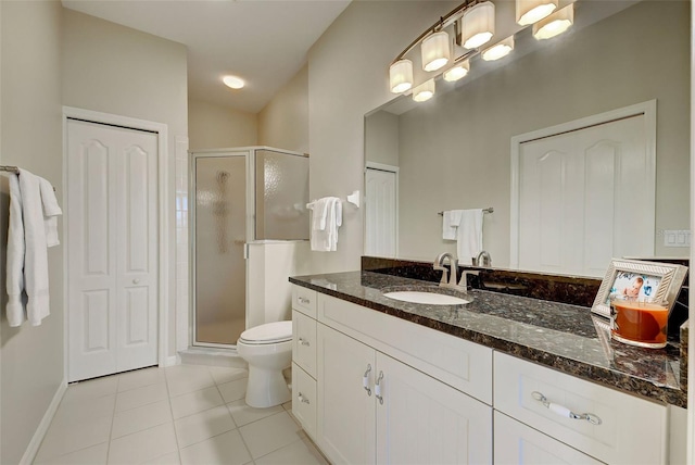 bathroom featuring toilet, tile floors, an enclosed shower, and vanity