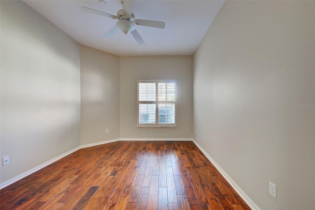 spare room featuring ceiling fan and dark hardwood / wood-style flooring