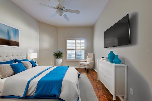 bedroom with ceiling fan and dark wood-type flooring