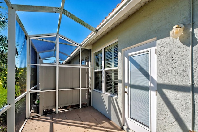 unfurnished sunroom featuring lofted ceiling