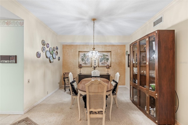 dining space featuring light colored carpet, crown molding, and an inviting chandelier