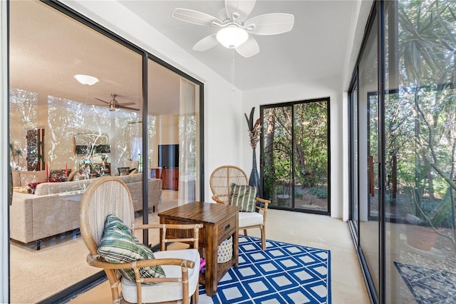 sunroom featuring ceiling fan