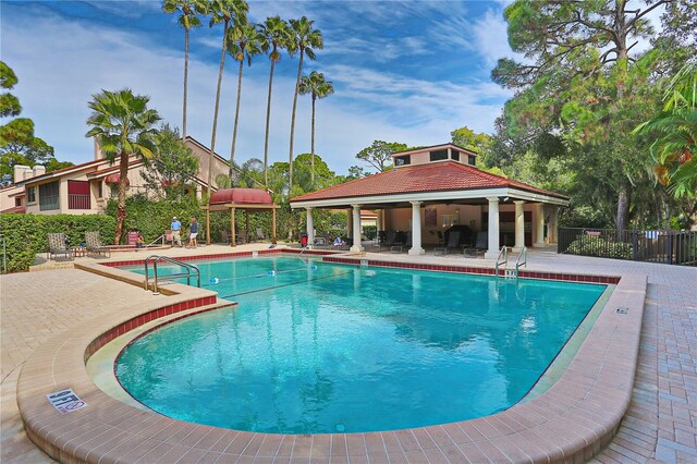 view of swimming pool with a patio area