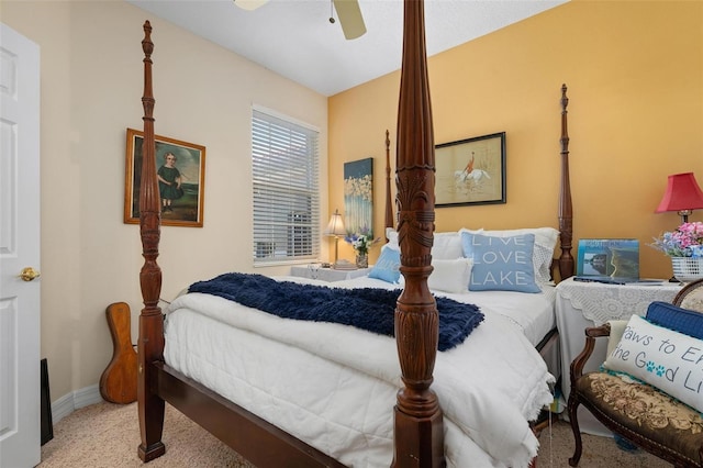 bedroom featuring light colored carpet and ceiling fan