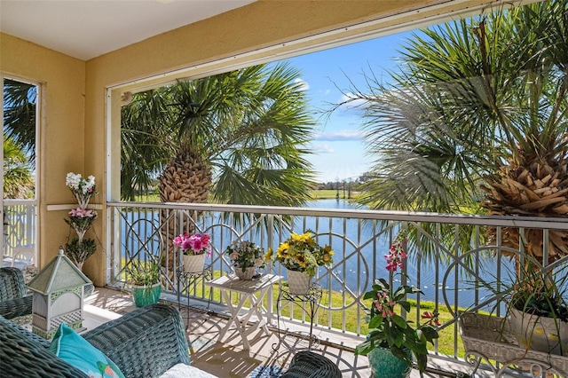 balcony featuring a water view