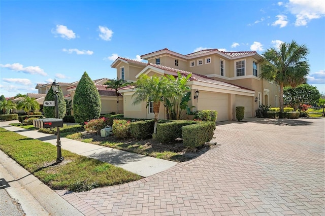 mediterranean / spanish house featuring a garage