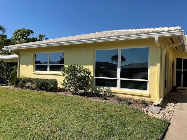 view of home's exterior featuring a lawn