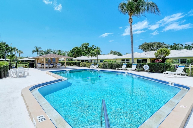 view of swimming pool with a patio