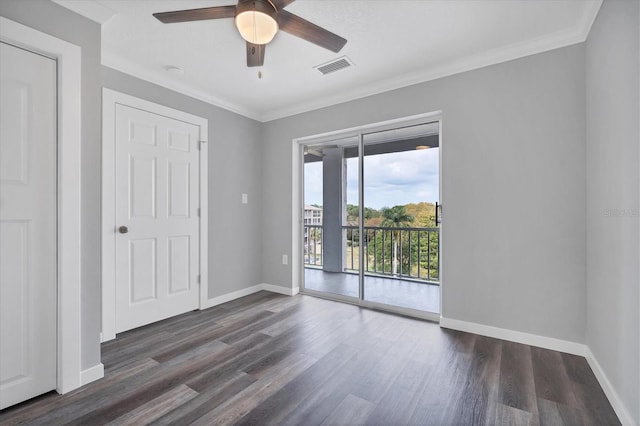 unfurnished room featuring ceiling fan, dark hardwood / wood-style floors, and ornamental molding