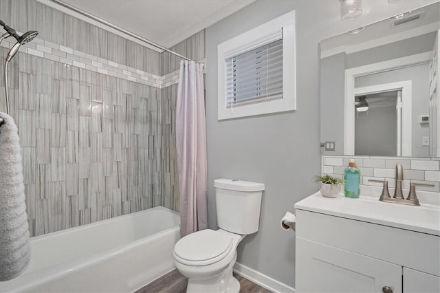 full bathroom with shower / bathtub combination with curtain, wood-type flooring, toilet, decorative backsplash, and vanity