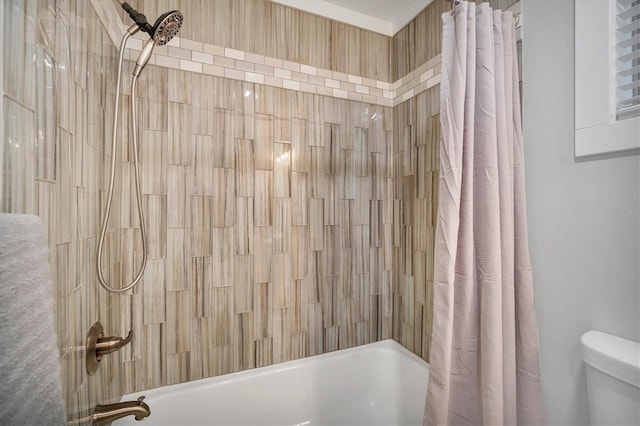 bathroom with shower / bath combination with curtain and toilet