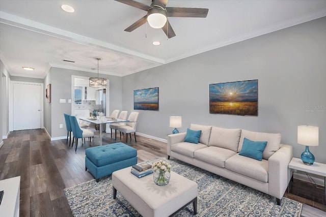 living room featuring crown molding, hardwood / wood-style floors, and ceiling fan