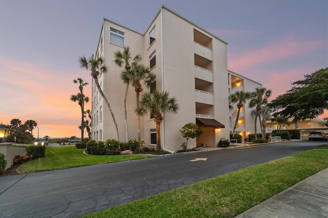 view of outdoor building at dusk