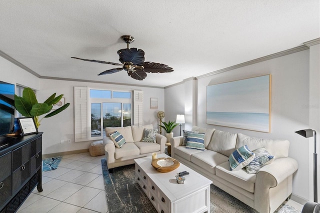 tiled living room featuring ceiling fan, ornamental molding, and a textured ceiling