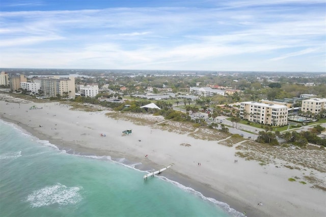 drone / aerial view with a water view and a view of the beach