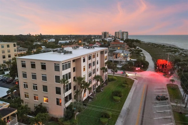 aerial view at dusk with a water view