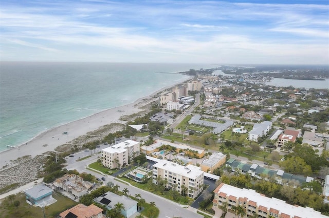 birds eye view of property with a water view and a view of the beach