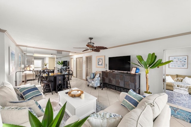 living room with light tile patterned flooring, ceiling fan, and crown molding