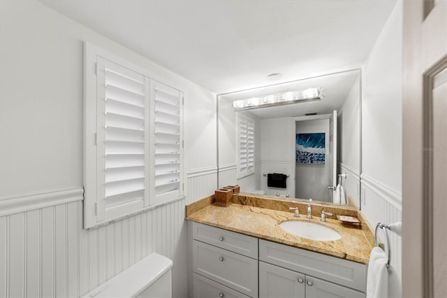 bathroom with vanity and toilet