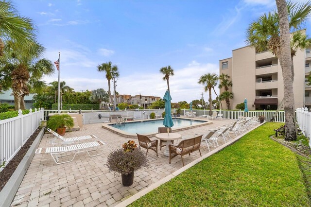 view of pool featuring a patio