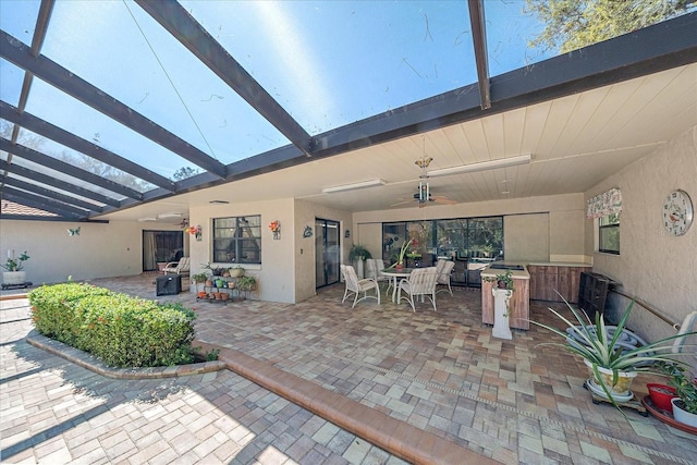 view of patio / terrace featuring ceiling fan