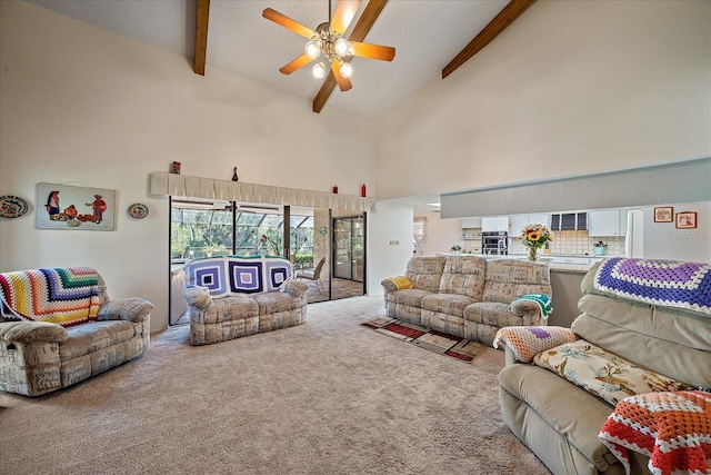 living room featuring beam ceiling, carpet floors, high vaulted ceiling, and ceiling fan