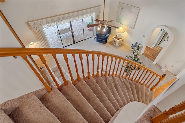 staircase with ceiling fan