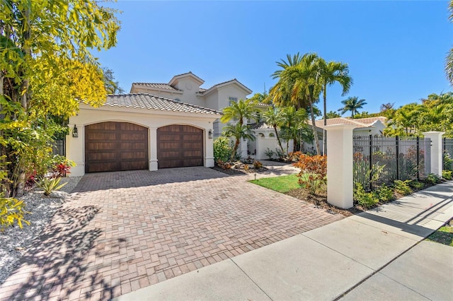 mediterranean / spanish-style house featuring a garage