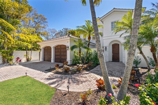 mediterranean / spanish-style home featuring a garage