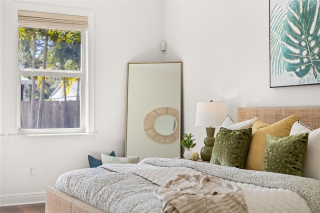 bedroom with hardwood / wood-style floors