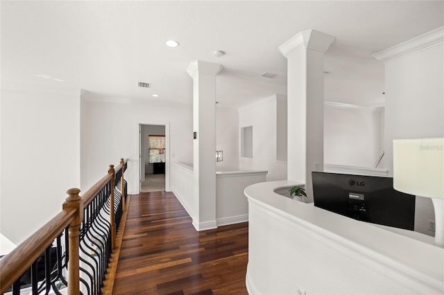 hallway featuring crown molding and dark wood-type flooring