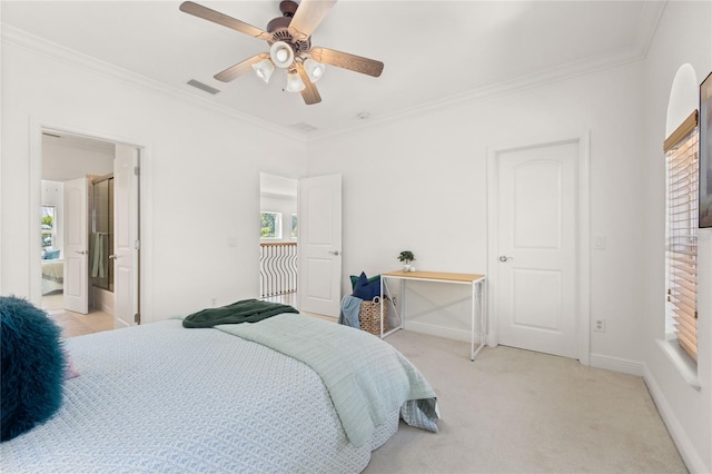 carpeted bedroom with connected bathroom, ceiling fan, and crown molding