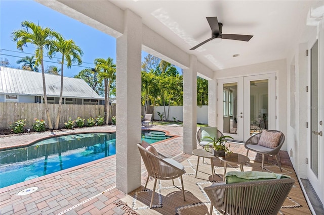 view of pool featuring french doors, a patio, and ceiling fan