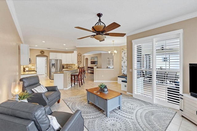 tiled living room featuring crown molding and ceiling fan with notable chandelier