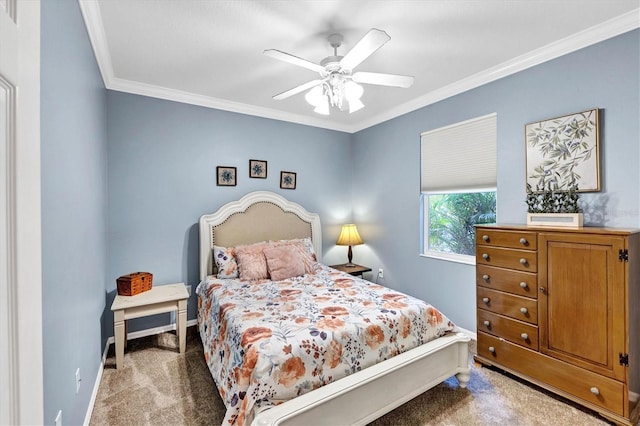 carpeted bedroom featuring ceiling fan and ornamental molding