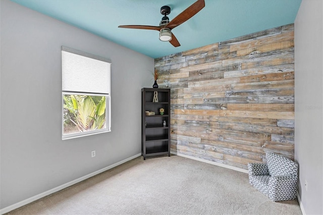 empty room with carpet flooring and ceiling fan