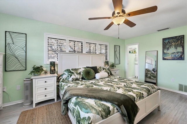 bedroom with ceiling fan and light hardwood / wood-style flooring