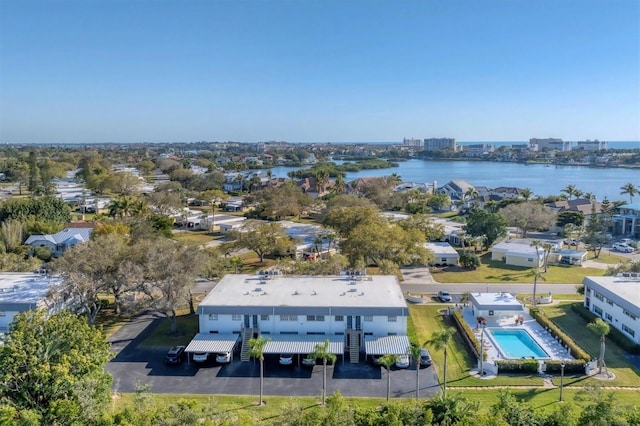 birds eye view of property with a water view