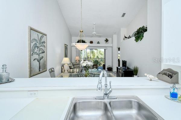 kitchen with ceiling fan and sink