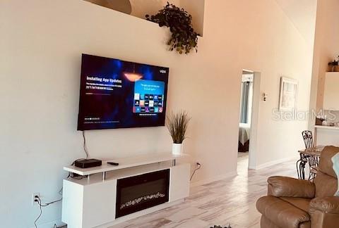 living room with a high ceiling