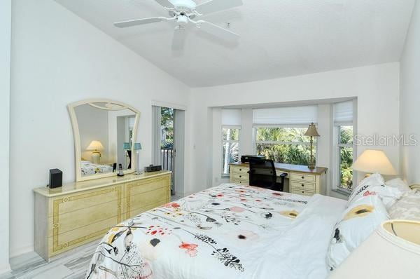 bedroom with ceiling fan and lofted ceiling