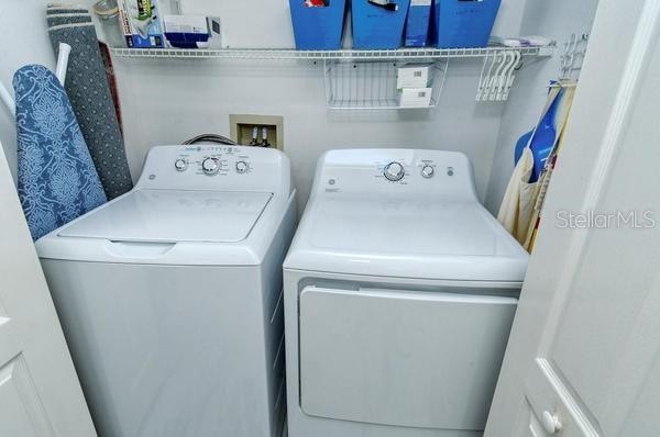 clothes washing area featuring washing machine and clothes dryer