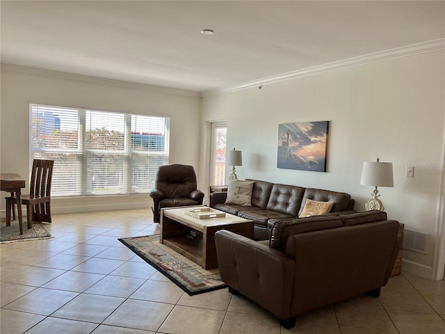 living room with light tile floors and crown molding