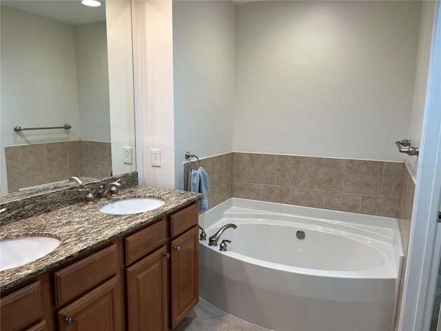 bathroom with tile floors, double vanity, and a washtub