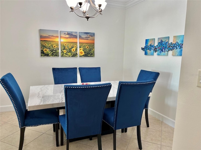 tiled dining area featuring an inviting chandelier and ornamental molding