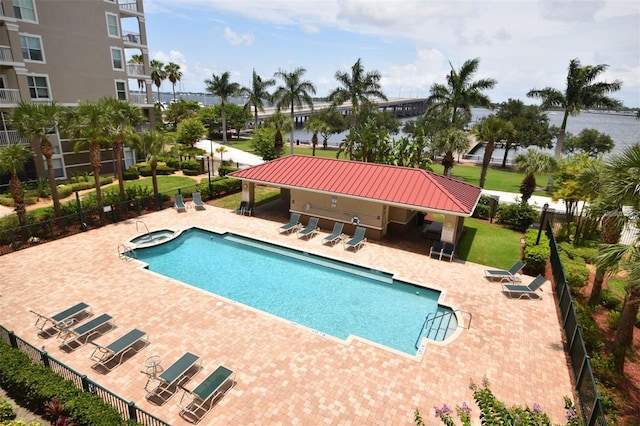 view of pool featuring a patio area and a lawn